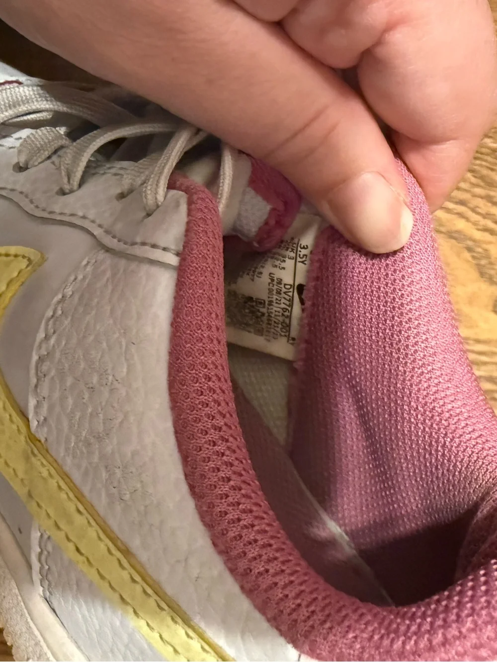 Nike Kids White Sneakers with Yellow Swoosh and Pink Lining